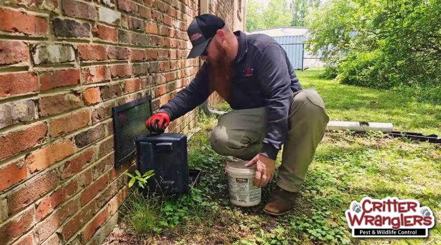 Critter Wranglers technician with service van