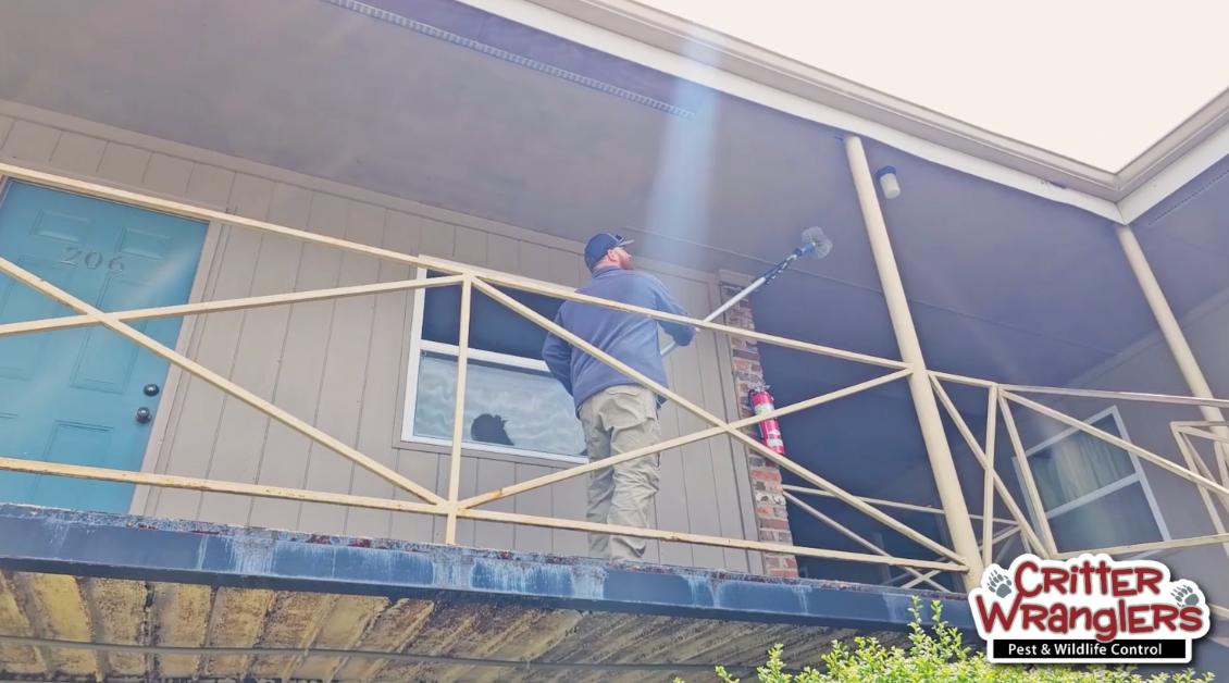 Critter Wranglers technician with service van