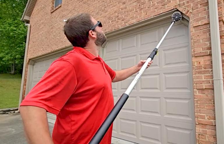 Critter Wranglers technician performing exterior pest treatment