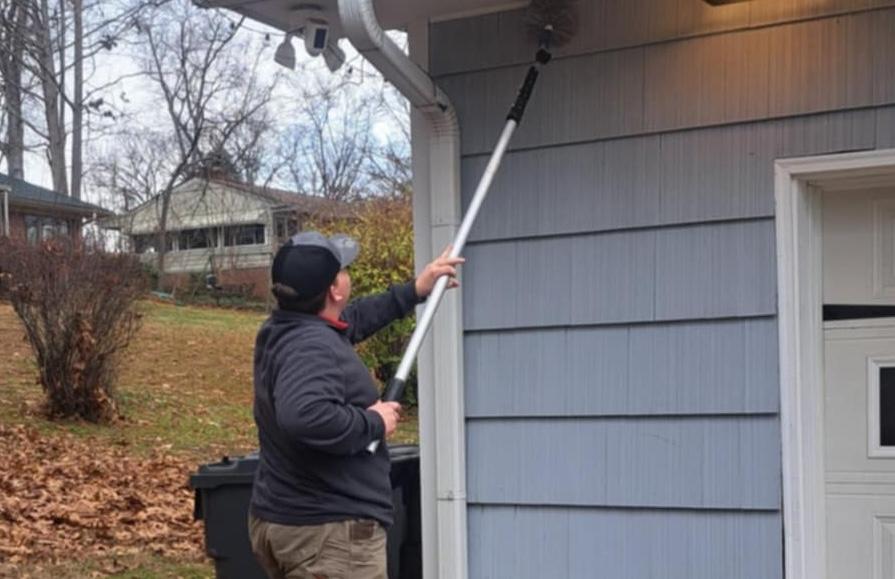 Critter Wranglers technician performing exterior stinging insect treatment